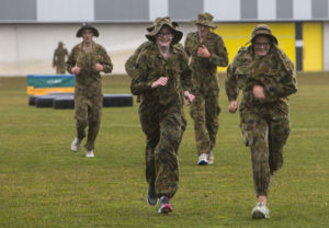 Australian Air Force Cadets Alleha Read and Monique Bolton run to the next obstacle during battle PT in the Canberra cold and rain at the Australian Defence Force Academy. *** Local Caption *** Australian Air Force Cadets (AAFC) from No 2 Wing commemorated the 75th anniversary of the AAFCs with a tour of military establishments and museums/memorials in Williamtown, Canberra and Sydney. The Australian Air Force Cadets (AAFC) is a youth oriented organisation that is administered and actively supported by the Royal Australian Air Force. The AAFC teaches you valuable life skills and will help you develop qualities including leadership, self reliance, confidence, teamwork and communication. Their fundamental aim is to foster qualities that will enable cadets to become responsible young adults, who will make a valuable contribution to the community. Please note the following distinction: Australian Air Force Cadets (AAFC), along with Australian Navy Cadets and Australian Army Cadets are members of the Australian Defence Force (ADF) Cadets. ADF Cadets are participants in the youth development program conducted by the three services in cooperation with the community but they are not members of the ADF. Officer Cadets (Air Force) and Staff Cadets (Army) are trainee officers undertaking instruction at the Australian Defence Force Academy or the Air Force Officers' Training School or Royal Military College Duntroon, The terms 'ADF Cadets', 'Officer Cadets' and 'Staff Cadets' are not interchangeable. Trainee naval officers are not cadets; they are commissioned officers with the rank of Midshipman.