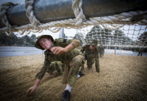 Australian Air Force Cadets Lachlan Bulmer tackles an obstacle during battle PT in the Canberra cold and rain at the Australian Defence Force Academy. *** Local Caption *** Australian Air Force Cadets (AAFC) from No 2 Wing commemorated the 75th anniversary of the AAFCs with a tour of military establishments and museums/memorials in Williamtown, Canberra and Sydney. The Australian Air Force Cadets (AAFC) is a youth oriented organisation that is administered and actively supported by the Royal Australian Air Force. The AAFC teaches you valuable life skills and will help you develop qualities including leadership, self reliance, confidence, teamwork and communication. Their fundamental aim is to foster qualities that will enable cadets to become responsible young adults, who will make a valuable contribution to the community. Please note the following distinction: Australian Air Force Cadets (AAFC), along with Australian Navy Cadets and Australian Army Cadets are members of the Australian Defence Force (ADF) Cadets. ADF Cadets are participants in the youth development program conducted by the three services in cooperation with the community but they are not members of the ADF. Officer Cadets (Air Force) and Staff Cadets (Army) are trainee officers undertaking instruction at the Australian Defence Force Academy or the Air Force Officers' Training School or Royal Military College Duntroon, The terms 'ADF Cadets', 'Officer Cadets' and 'Staff Cadets' are not interchangeable. Trainee naval officers are not cadets; they are commissioned officers with the rank of Midshipman.