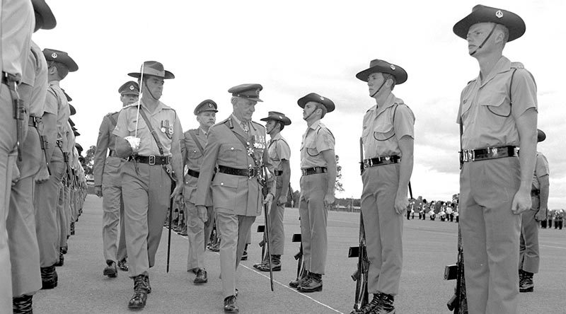 FILE PHOTO (1983): Soldiers of 3RAR parade at Holsworthy parade for the 32nd anniversary of The Battle of Kapyong. They are inspected by the Colonel Commandant of The Royal Australian Regiment , General Sir Arthur Macdonald, escorted by Lieutenant Colonel Jim Connolly, CO 3RAR. Also on parade were 120 Scots Guards, in Australia for training with 3RAR. Australian Army file photo by Private Talon.