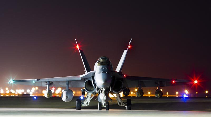 A Royal Australian Air Force F/A-18A Hornet prepares to depart on a mission to strike a Deash headquarters compound in Mosul, Iraq, from Australia's main air operating base in the Middle East region. Photo by Corporal Nicci Freeman