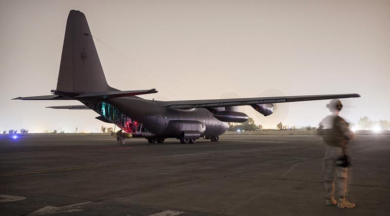 A New Zealand soldier provides force protection as a Royal New Zealand Air Force C-130 Hercules aircraft carrying New Zealand and Australian soldiers prepares to take off from the Taji military complex in Iraq. ADF photo