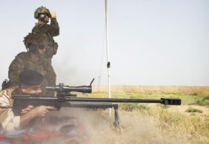 Australian Army soldier Warrant Officer Class Two Michael Keefe (rear) and Corporal Stefan Pitruzzello provide training advice to an Iraqi soldier during advanced marksmanship training. Photo by Corporal Jake Badior