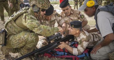 Australian Army soldier Corporal Stefan Pitruzzello makes a scope adjustment on a variant of the Steyr HS .50-calibre rifle while training Iraqi Army personnel in Iraq. Photo by Leading Seaman Jake Badior