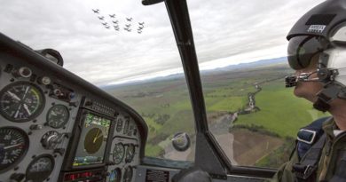 Lieutenant Commander Andrew Kidd, a qualified flying instructor at the ADF Basic Flying Training School, follows a formation of 16 Pacific Aerospace CT-4B Airtrainers flying over Tamworth. Photo by Corporal Ollie Carter