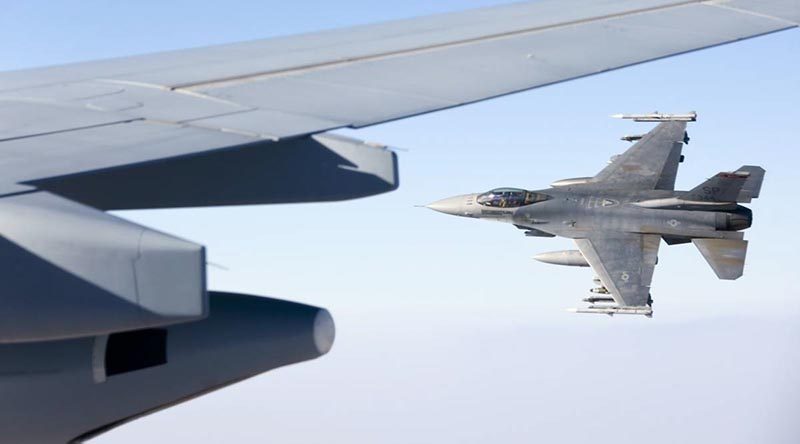 A 480th Fighter Squadron "Warhawks" F-16C flies alongside after refuelling from a KC-30A Multi-Role Tanker Transport air-to-air refuelling aircraft over the Middle East Region. Photo by Corporal Nicci Freeman