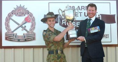 Corporal Daniel Keighran VC presents the Daniel Keighran VC Trainee of Merit Trophy to Cadet Corporal Brooklyn Davis