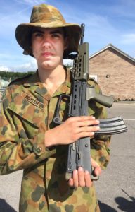 Cadet Lance Corporal Jayden Butler gets a drill orientation lesson with the standard-issue rifle of the UK Defence Forces.