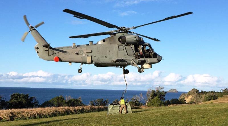 The Seasprite helicopter drops off one of its underslung loads on Raoul Island. RNZDF photo