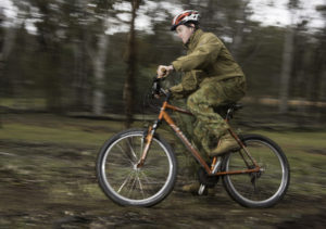 An Australian Army Cadets trainee competes in the mountain bike time trial during the annual field exercise in Bindoon training area, north-east of Perth, on 1 October 2016.