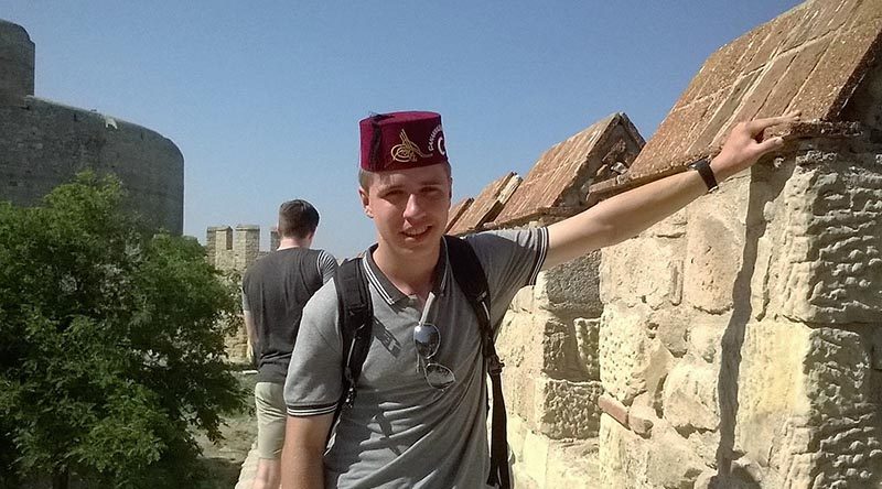 Cadet Under Officer David Neilson with one of three Fez's brought home.