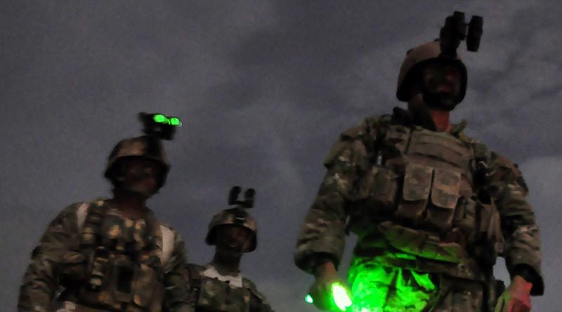 Members of Australia's Special Operations Task Group (SOTG) prepare to fly into Oruzgan's Baluchi Valley and Chora regions in support of an MTF1 mission, in 2010. Photo by Lieutenant Aaron Oldaker.