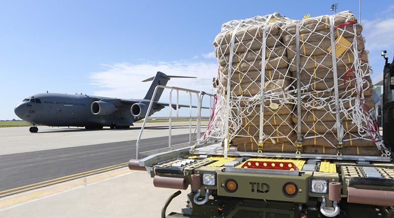 Pallets of sandbags arrive at RAAF Base Edinburgh delivered by a No 36 Squadron C-17A Globemaster. Photo by Corporal Craig Barrett.
