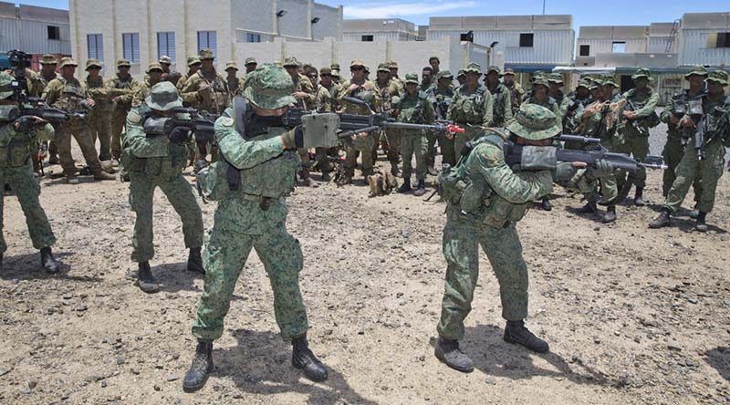 Singapore Army soldiers demonstrate urban assault techniques at Shoalwater Bay Training Area. File photo by Corporal David Cotton.