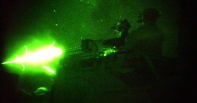 Special Forces Task Group (SFTG) members fire vehicle-mounted heavy weapons at night on a range at a Forward Operating Base (FOB) in Afghanistan. File photo – 2005 – by Sergeant John Carroll.