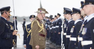 Governor-General Sir Peter Cosgrove talks to a RAAF member during a parade to mark the Centenary of Numbers 1, 2, 3 and 4 Squadrons. Photo by Corporal Nicci Freeman.