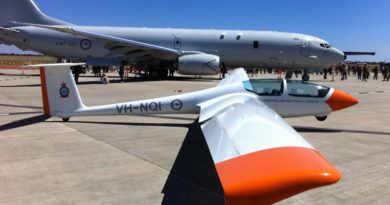 One of 6 Wing’s gliders, the ASK-21 Mi, sits on the tarmac at RAAF Edinburgh beside Australia’s new Maritime Patrol Aircraft – the P-8A Poseidon