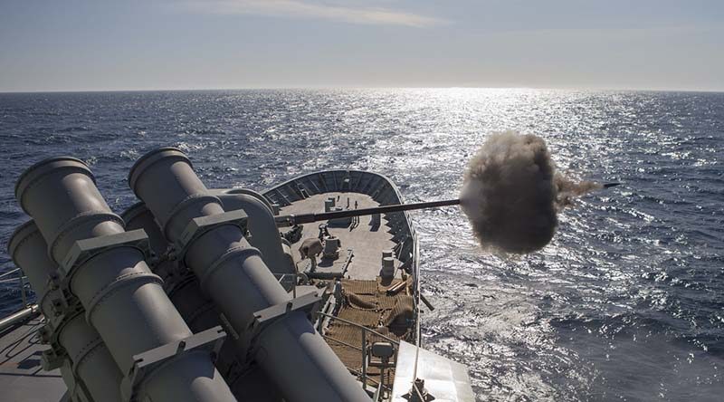 HMAS Arunta fires her 5-inch gun against a simulated fast boat attack during the Fleet Concentration Period 2015. Photo by Leading Seaman Bradley Darvill.