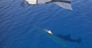 A C-130J Hercules overflies a Royal Australian Navy Collins-class submarine off the WA coast. Photo by Corporal David Gibbs.