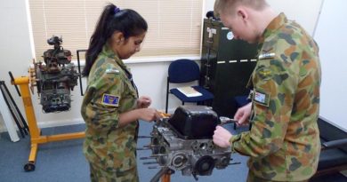 Leading Cadet Jay Dolphin from 619 (‘City of Onkaparinga’) Squadron at Seaford, and Cadet Shivani Patel from 601 Squadron at Keswick Barracks get a 'hands-on' insight into an aircraft engine.