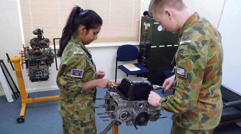 Leading Cadet Jay Dolphin from 619 (‘City of Onkaparinga’) Squadron at Seaford, and Cadet Shivani Patel from 601 Squadron at Keswick Barracks get a 'hands-on' insight into an aircraft engine.