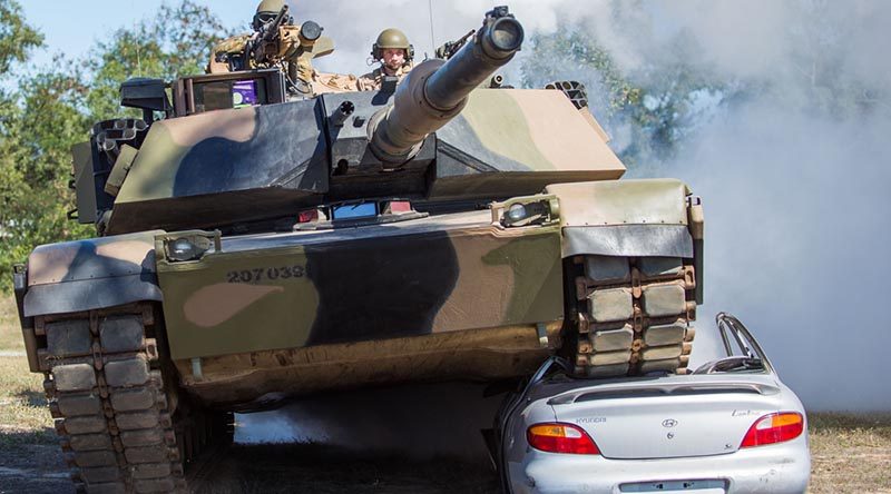 Australian Army soldiers from 2nd Cavalry Regiment demonstrate the power of their M1A1 Abrams tank as part of 3rd Brigade's Lavarack Barracks open day activities in north Queensland on Saturday, 3 September 2016. Photo by Sapper Josh Saurin.