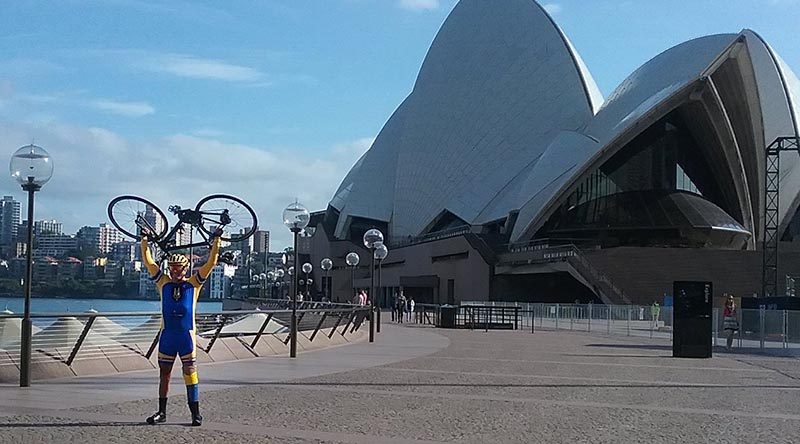 Laurie ‘Truck’ Sams celebrates reaching the Sydney Opera House at the end of an epic 10,200km bike ride – The Long Ride Home – from Hanoi, Vietnam. Photo by CONTACT 'roving reporter' Sue Monckton.