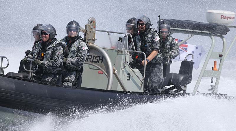 HMAS Perth's boarding party smash through rough seas to close with a vessel of interest in the Middle East Region. Photo by Able Seaman Richard Cordell.