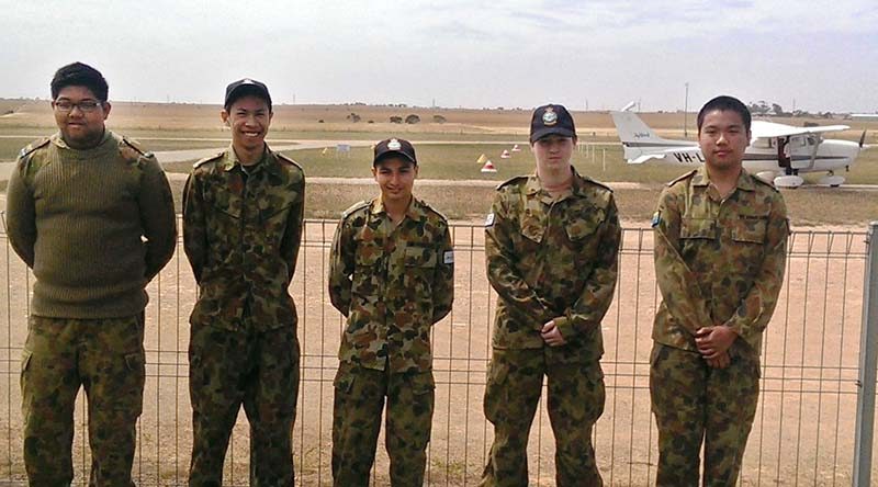 Cadets Khris Alcantara, Amiel Lania, Angello Deionno and Harrison Allam, and Cadet Corporal Rex Catipay with the Cessna 172 Skyhawk they are about to pilot.