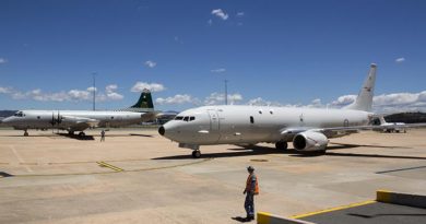 Australia's first P-8A Poseidon aircraft at Defence Establishment Fairbairn parked next to an 11 Squadron P-3 Orion, the aircraft it will replace. Photo by Flight Sergeant Kev Berriman.