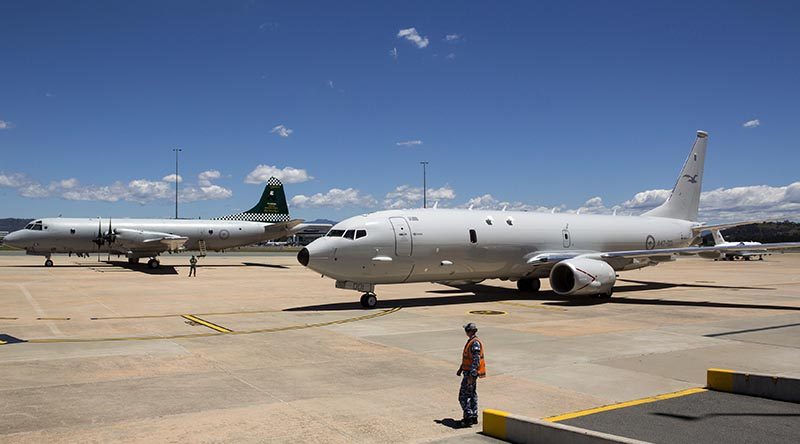 Australia's first P-8A Poseidon aircraft at Defence Establishment Fairbairn parked next to an 11 Squadron P-3 Orion, the aircraft it will replace. Photo by Flight Sergeant Kev Berriman.