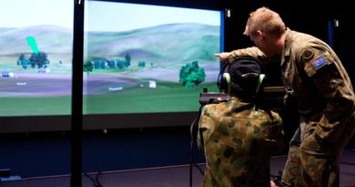 Lieutenant Dustin Gold assists a visitor at the Singleton Army WTSS (Weapon Training Simulation System) complex sight targets for a simulated 66mm anti-armour rocket. Photo by Leading Seaman Brenton Freind.