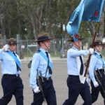 609 Squadron Banner Bearer Cadet Sergeant Alexander Burrow, with Banner Escorts Leading Cadets Charlie Morman and Lucille Rattigan. The Banner Warrant Officer (saluting) is Cadet Sergeant Aaron Taliangis.