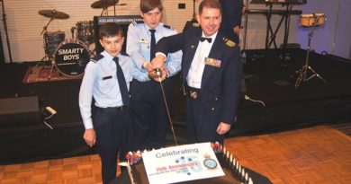 Group Captain Richard Trotman-Dickenson, with the most junior cadet and most senior cadet in uniform Cadet Adomas Neocleous and Cadet Under Officer Lachlan Renfrey, both from 619 (‘City of Onkaparinga’) Squadron at Seaford, cut the anniversary cake.