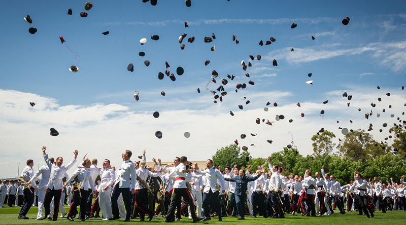 The class of 2016 throw their hats in the air to symbolise completion of three years military training and academic studies. They will now be posted to locations across Australia for further training or to commence their new postings. Photo by Michael Jackson-Rand