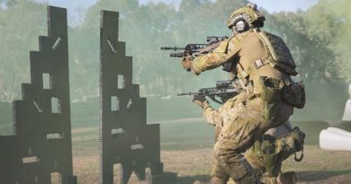 Corporal James Cunningham and Corporal Karl Fabreschi (kneeling) clear the range of 'enemy' activity during the combat shooting skills training activity at Majura training area outside Canberra. Photo by Corporal Nunu Campos.