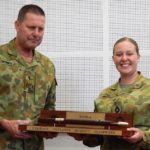 RSM-A WO Don Spinks presents CUO Ashlie Wilkie, 22 Australian Army Cadet Battalion , with the RSM-A National Drill competition pace stick.