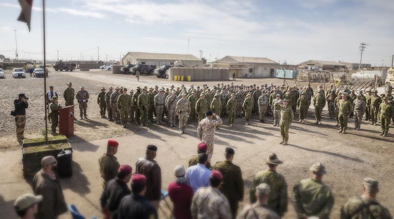 Commander Task Group Taji Colonel Andrew Lowe salutes Deputy Commander Training - Combined Joint Forces Land Component Command, Operation Inherent Resolve, Brigadier General Francesco Ceravolo at the Task Group Taji 3/4 transfer of authority parade at the Taji Military Complex in Iraq. Photo by Leading Seaman Jake Badior.