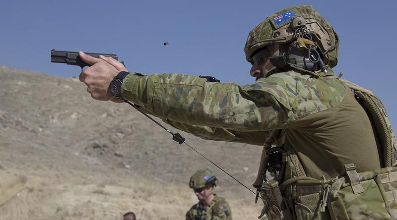 Australian Army soldier, Corporal Michael Piliaé-Smith, deployed with Force Protection Element 6, maintains his shooting skills on the L9A1 pistol in Qargha, Afghanistan. Photo by Flight Lieutenant Jessica Aldred.