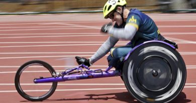 Mark Urquart pumps his fist in triumph as he wins the 400m wheelchair race at the Invictus Games 2016 in Orlando, Florida. Photo by Leading Seaman Jayson Tufrey.