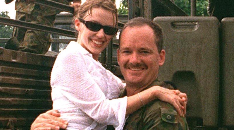 Kylie Minogue gets a pick-me-up from then Corporal Brian Hartigan in East Timor, reporting for ARMY News in 1999.