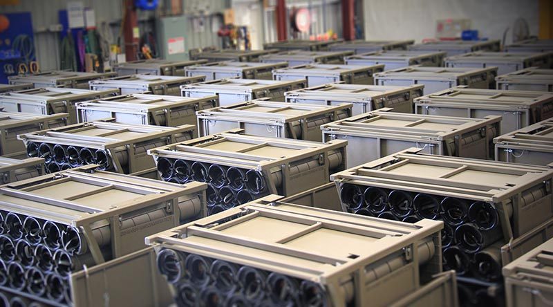 Australian Army unit load ammunition containers in a warehouse ready for delivery to artillery soldiers for the safe transport and storage of 155mm ammunition in the field.