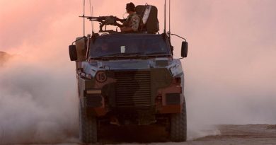 Australian soldiers on patrol in Afghanistan aboard a Bushmaster. Photo by Corporal Bernard Pearson.