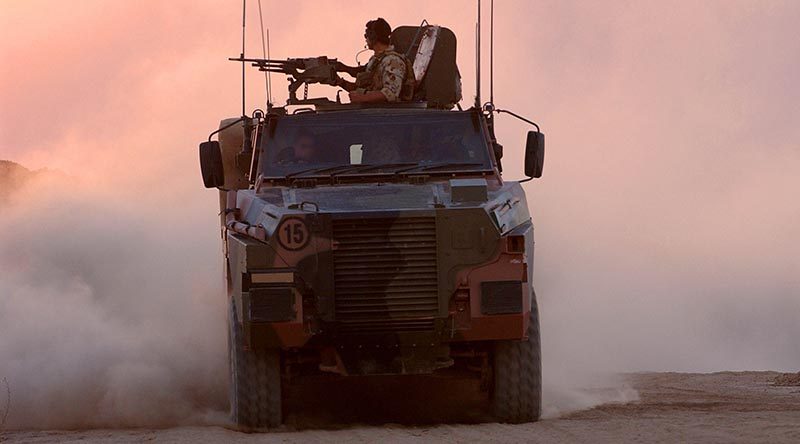 Australian soldiers on patrol in Afghanistan aboard a Bushmaster. Photo by Corporal Bernard Pearson.