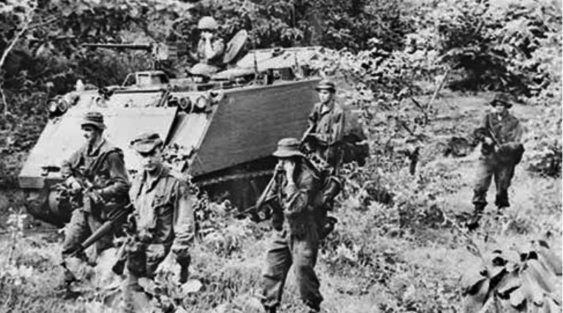 One of thousands of photos taken by Billy Cunneen in Vietnam – 1966, Australian APCs of 1 APC Sqn and dismounted soldiers pursue retreating Viet Cong troops in Phuoc Tuy Province. Click to enlarge.