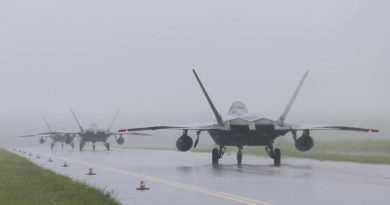 F-22s arrive at RAAF Base Tindal during a monsoonal downpour. Photo by Sergeant Andrew Eddie.
