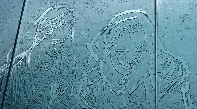 A glass-panel depiction of Australian Army nurses in WWII – part of a magnificent national memorial to Service Nurses on Anzac Parade, Canberra, dedicated in 1999. Photo by Brian Hartigan.