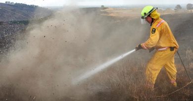 Firefighter Lieutenant Oli Barnfather of the New Zealand Army fights an underground hotspot on the Port Hills of Christchurch. NZDF photo.