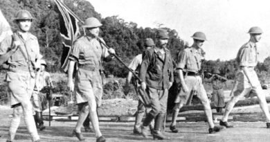 Lieutenant-General Arthur Ernest Percival, led by a Japanese officer, walks under a flag of truce to negotiate the capitulation of Allied forces in Singapore, on 15 February 1942. It was the largest surrender of British-led forces in history.