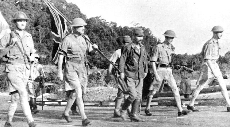 Lieutenant-General Arthur Ernest Percival, led by a Japanese officer, walks under a flag of truce to negotiate the capitulation of Allied forces in Singapore, on 15 February 1942. It was the largest surrender of British-led forces in history.