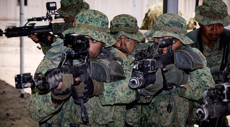 Singapore Army soldiers demonstrate urban assault techniques at the Shoalwater Bay training area, Queensland, during Exercise Trident in November 2014.